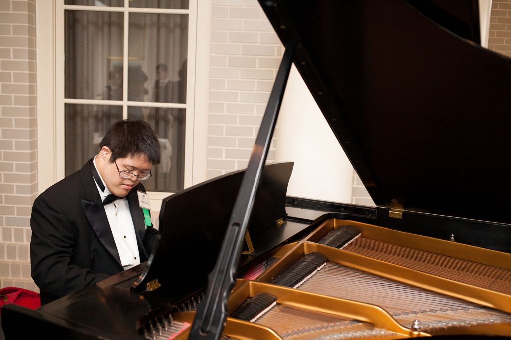 Dover Y member Randy Chang played the piano during the reception.