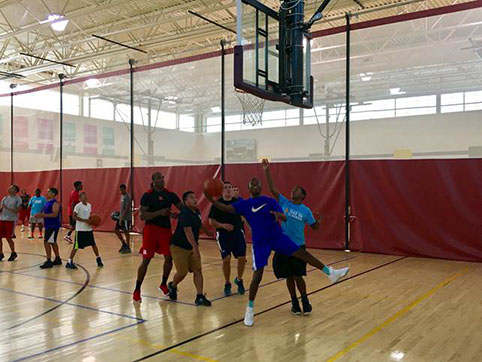 Bear Glasgow Family YMCA participants playing a friendly game with Troop 2 officers.